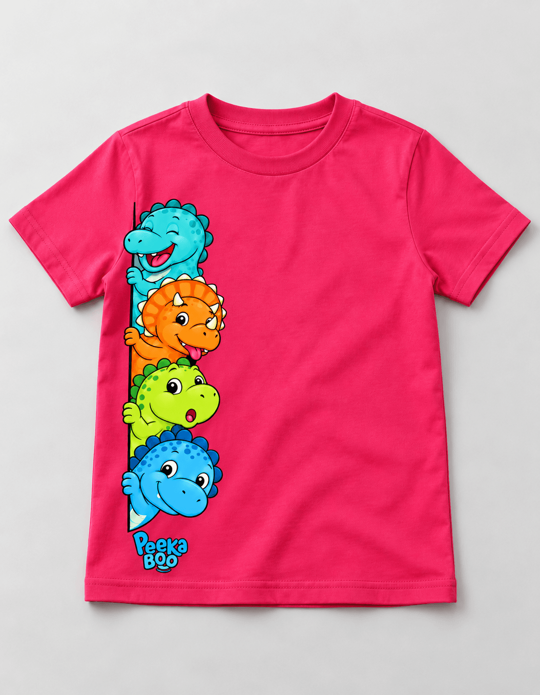 Pink kids tee with four cartoon dinosaurs peeking around the left edge
